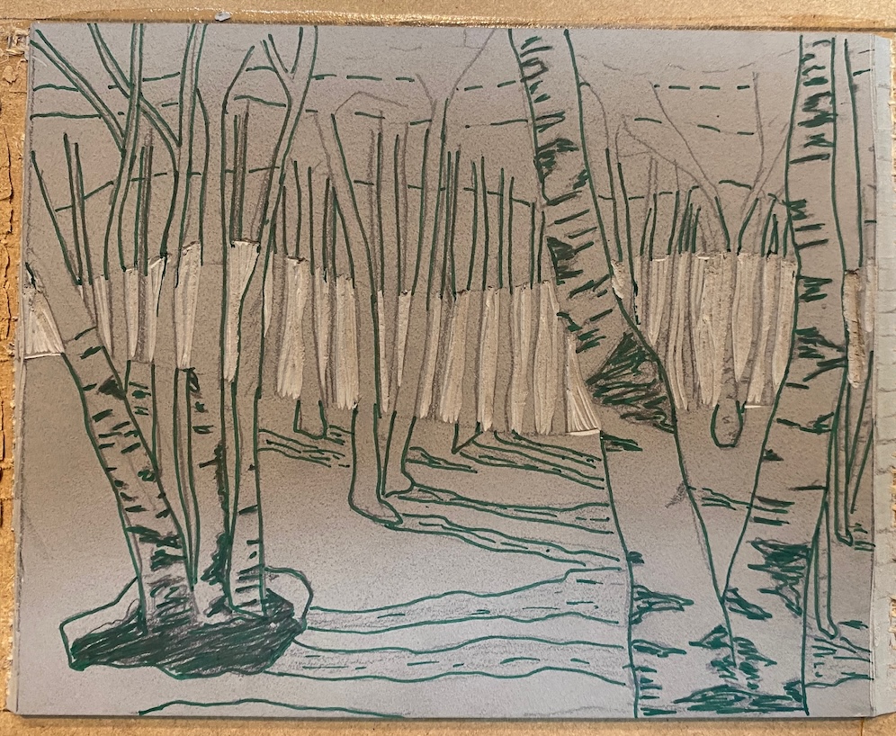 A partially carved lino block, with image of birch trees sketched on with Sharpie.
