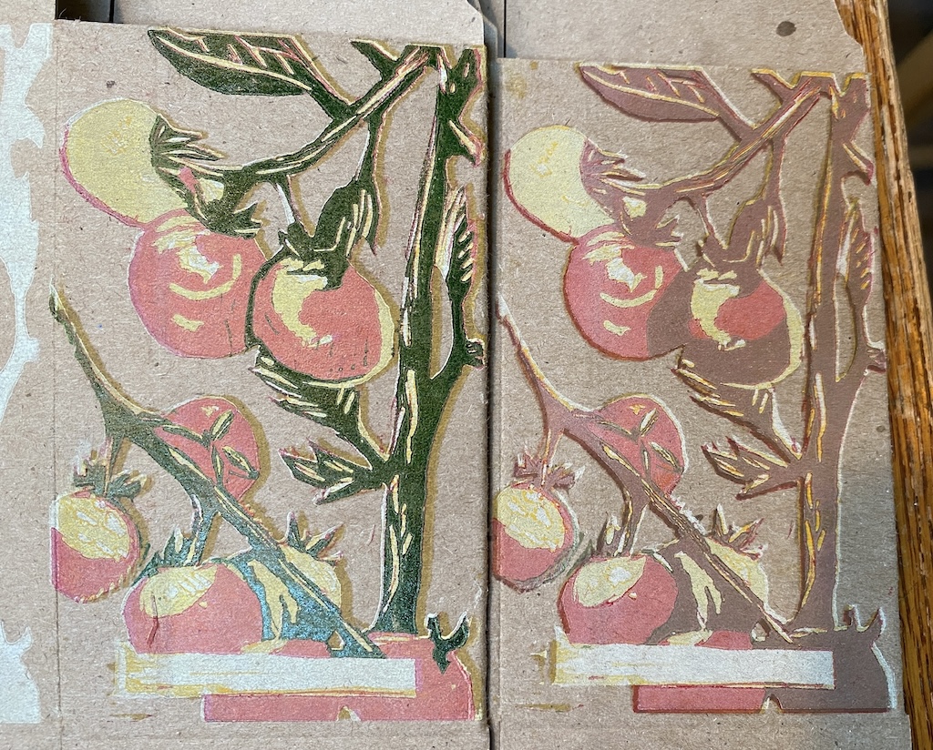 Two different boxes, each with green layer printed. The left box with oil-based green letterpress ink, the right side with water-based Akua intaglio ink.