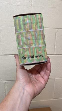 Box overprinted with "Spread good"