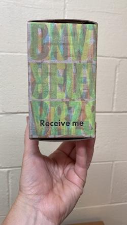 Box overprinted with "Receive me"