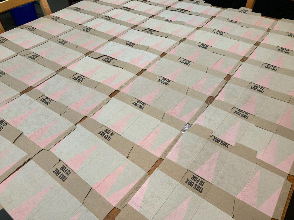 Boxes printed and set out to dry with pink tree layer printed.