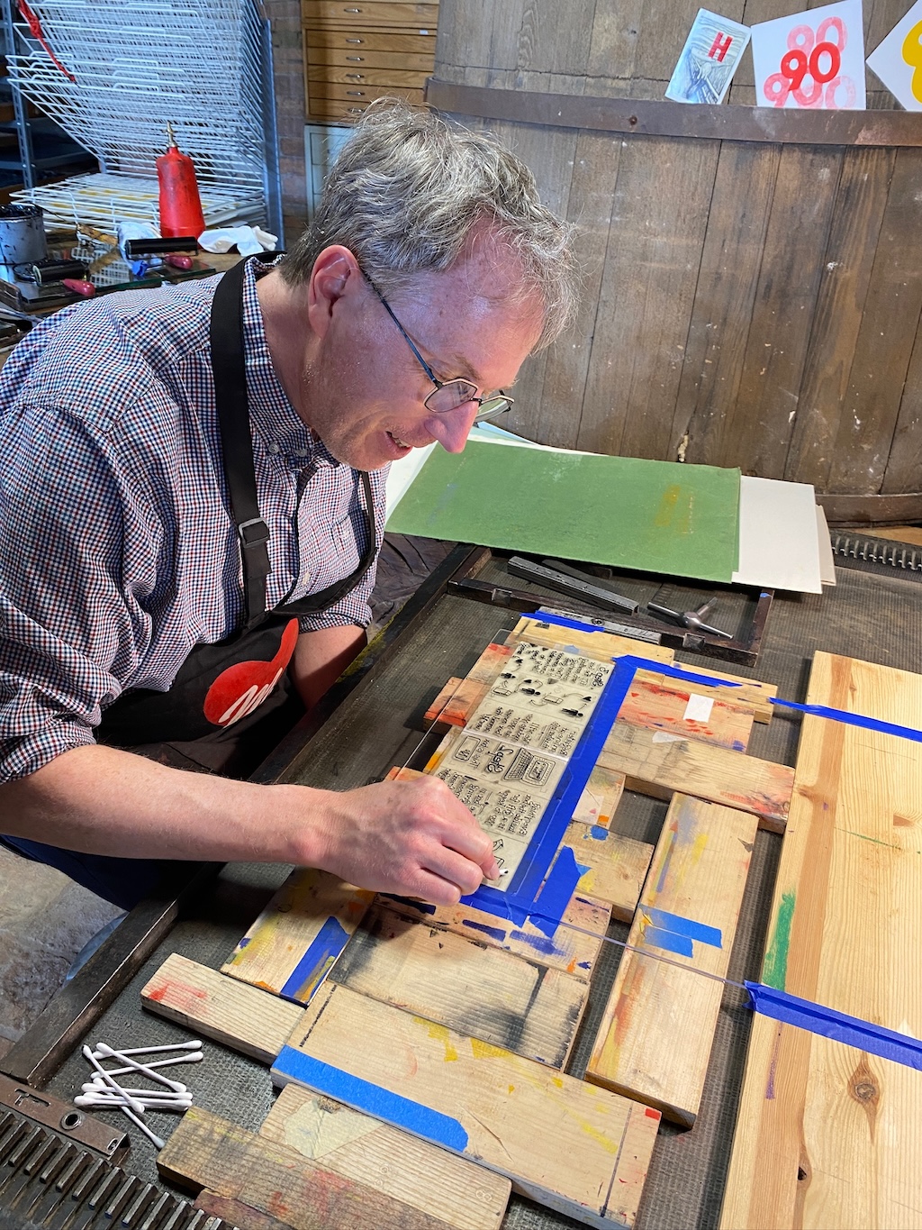 Peter cleaning up the plate for printing.