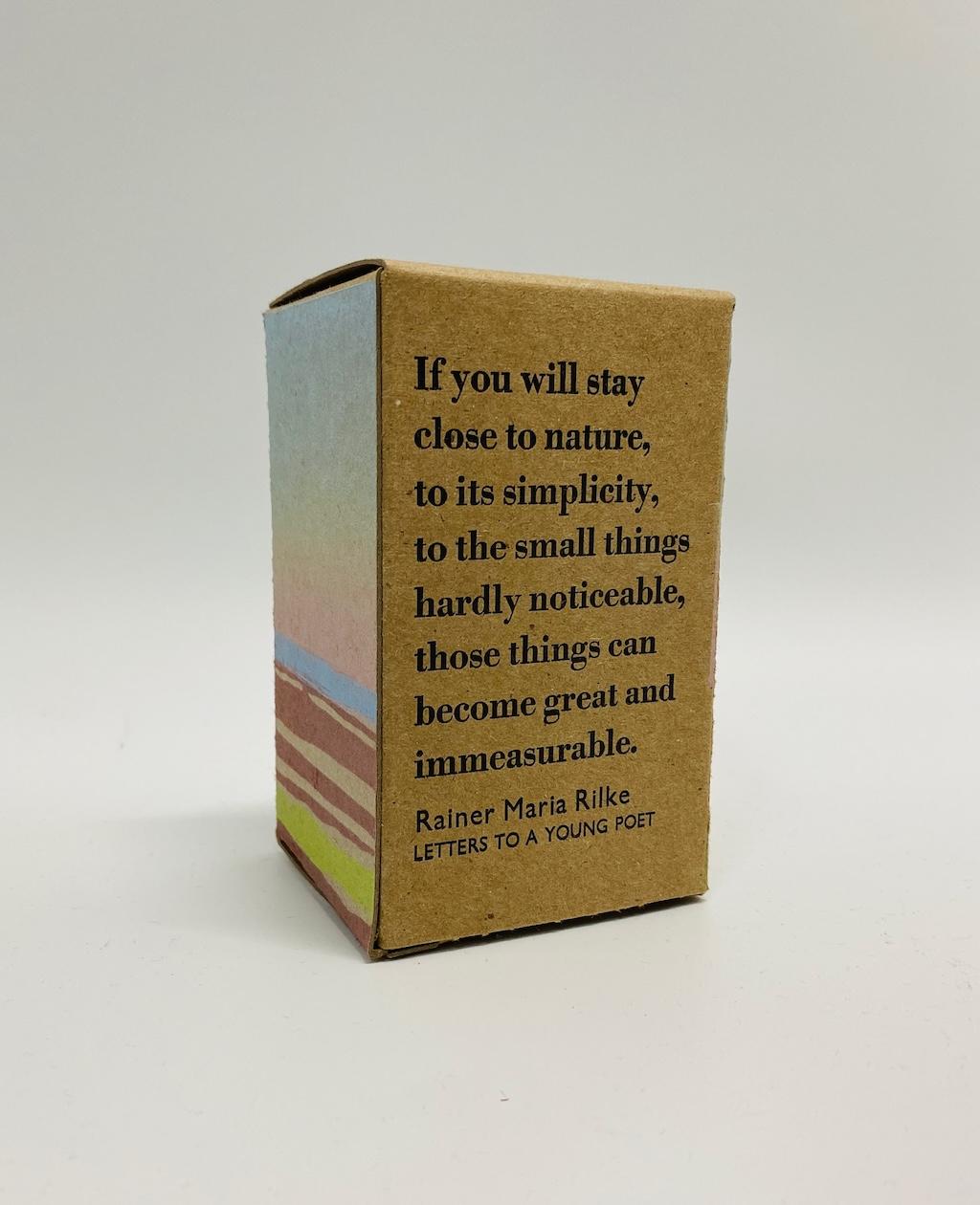 The Rilke quote printed on the back of the box.