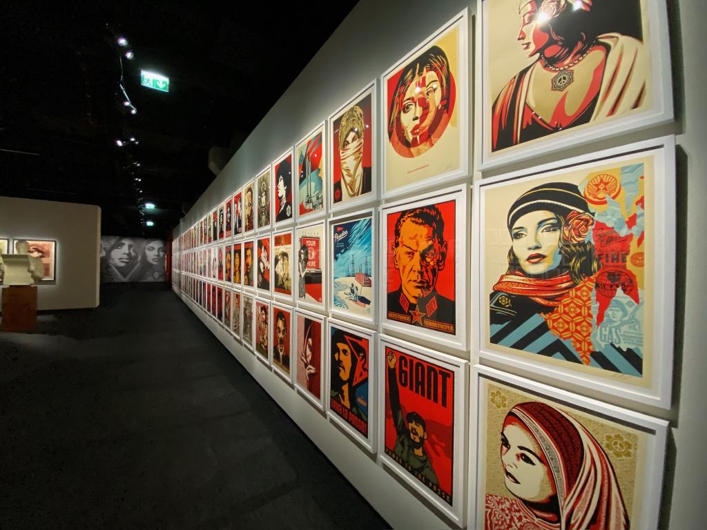 Examples of Fairey's work on the wall at Fotografiska, mostly portraits.