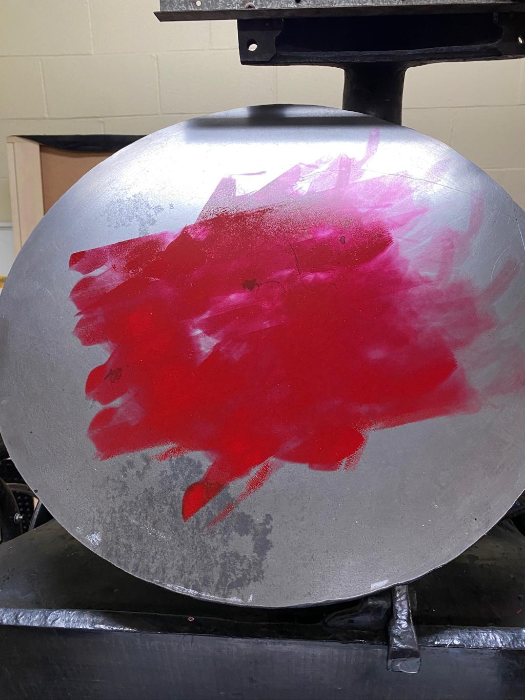 Red ink on the ink disc of the letterpress.