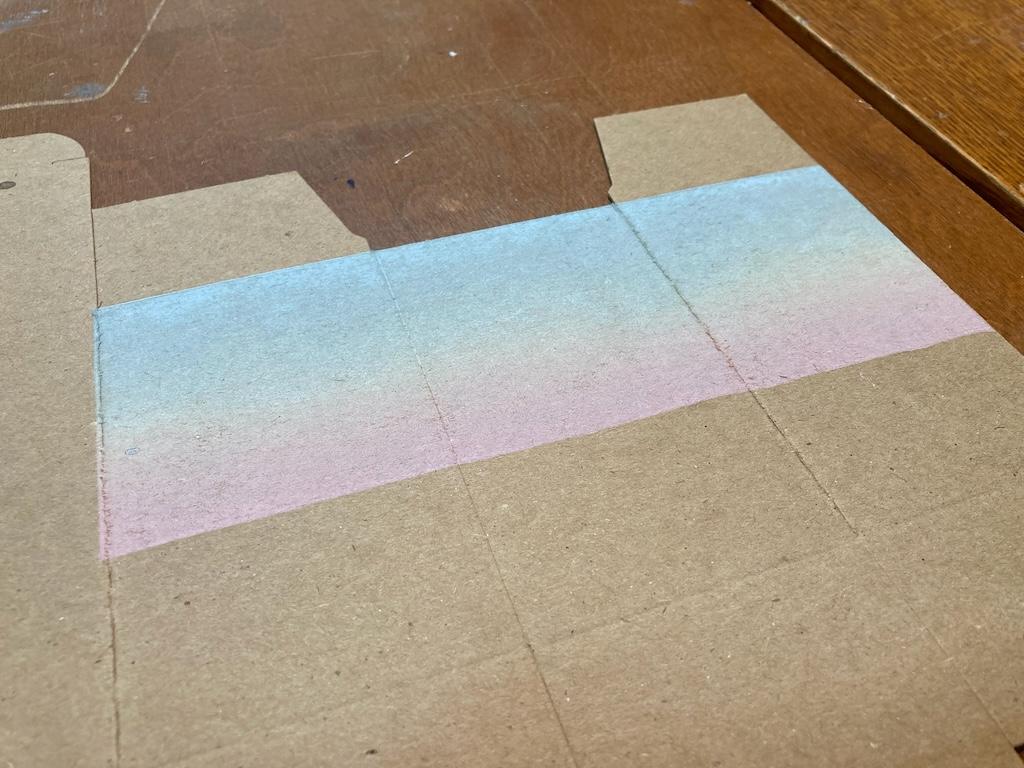 A single box printed with the rainbow roll.