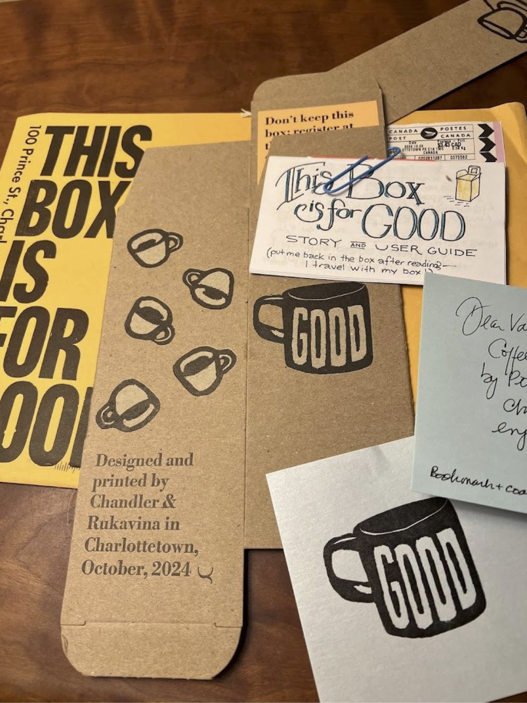 Hey This Box is for Good package received in the mail: the box itself, the zine, a note, and the envelope it came in.