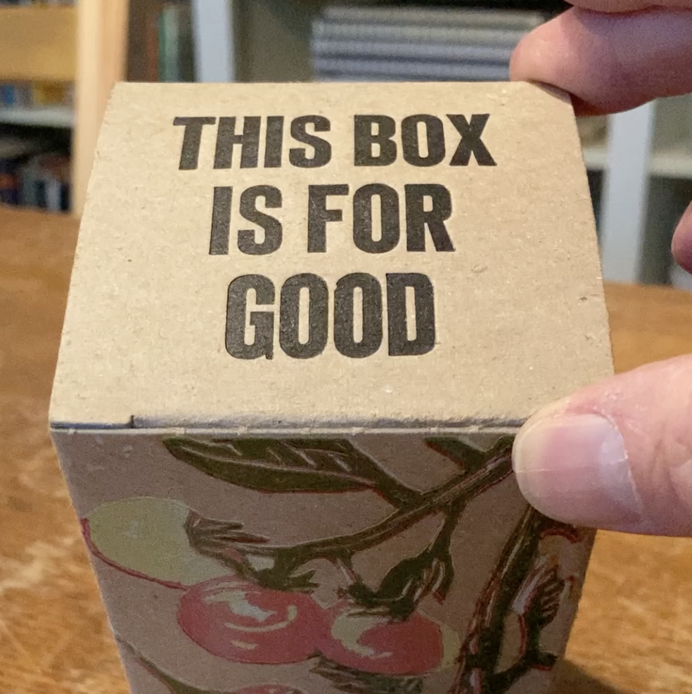 The top flap of a This Box is for Good cardboard box.