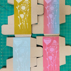 Four colours of the printed box, in a grid.