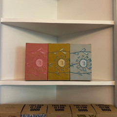 Three printed and assembled boxes, photographed on a white shelf.