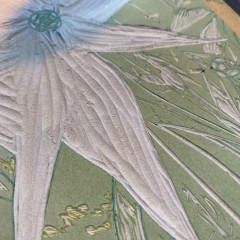 Detail of the lino block showing a zinnia leaf.