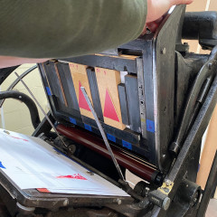 Setting up the press to print the red trees.