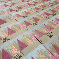 Boxes, unassembled, laid out to dry.