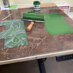 The carved block with green ink.