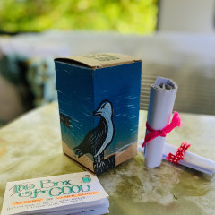 Finished box on a table alongside the items from the inside