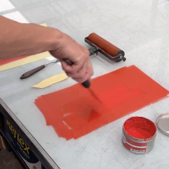 Red ink being rolled out